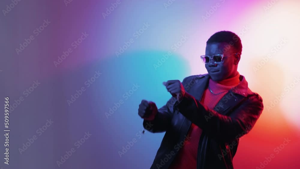 Happy dance. Party fun. Weekend joy. Great offer. Boomerang motion. Gif loop of joyful inspired man celebrating success in bright neon light gradient copy space.
