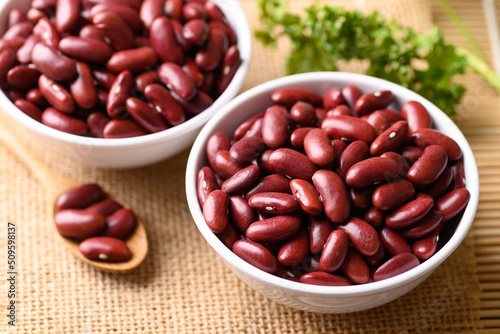 Red kidney beans in bowl on wooden table, Food ingredients