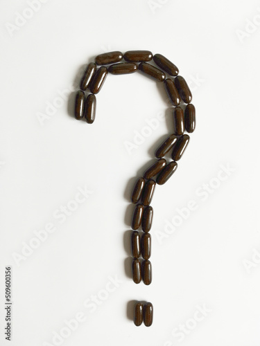  black tablets in the form of a question mark top view