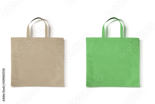 Blank green and beige non-woven bag mockup isolated on white background. eco friendly concept. 3d rendering. photo