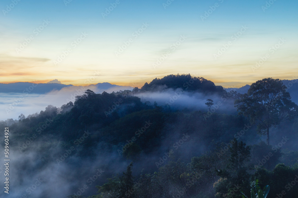 Beautiful flowing clouds and the mist in front of the mountains at Khao Khai Nui in sunrise time, Phang-Nga Province, Thailand