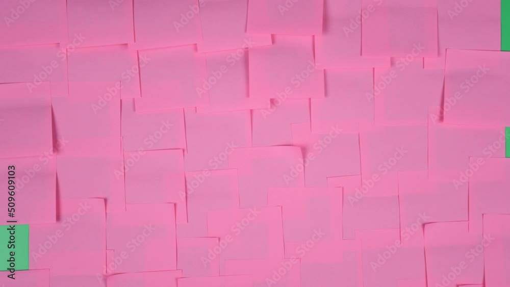 Many note paper on a green background - Stop Motion Animation.