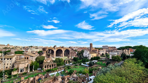Bild auf Leinwand Panoramic view from Palatine hill on exterior facade of famous Colosseum (Coloseo) of city of Rome, Lazio, Italy, Europe