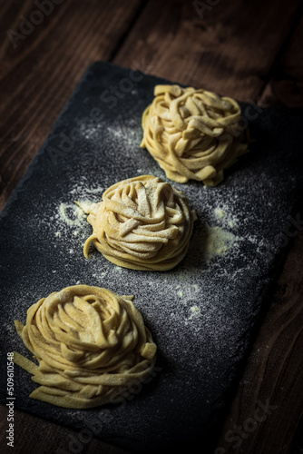 Fresh homemade pasta on the black board