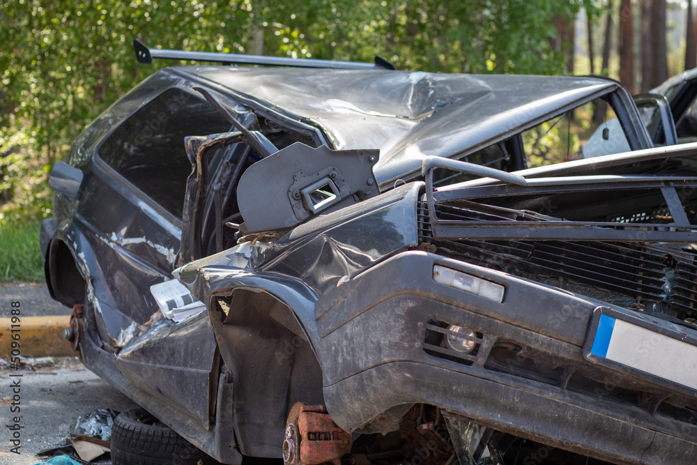 Traffic accident on the street, damaged car after a collision in the city. Accident due to speeding and alcohol intoxication. Transport background. The concept of road safety and insurance. Traffic accident on the street, damaged car after a collision in the city. Accident due to speeding and alcohol intoxication. Transport background. The concept of road safety and insurance.
