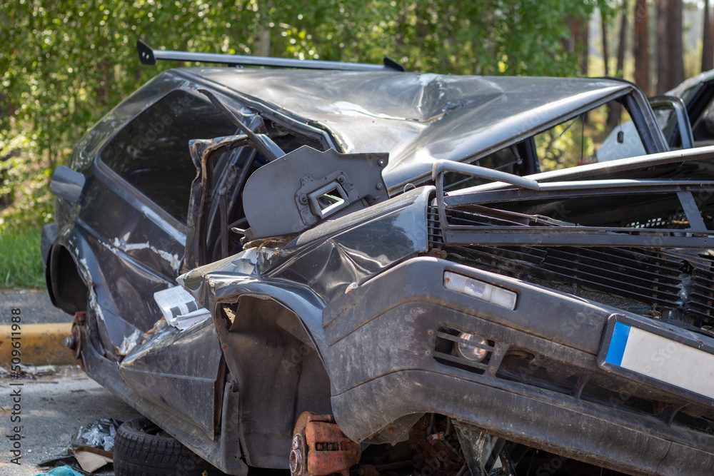 Traffic accident on the street, damaged car after a collision in the city. Accident due to speeding and alcohol intoxication. Transport background. The concept of road safety and insurance.