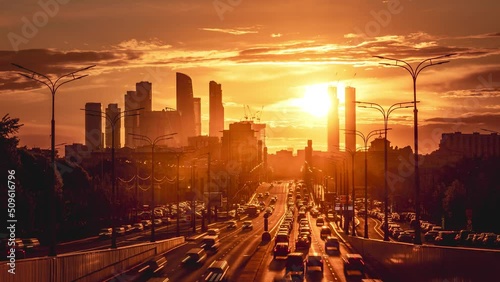 Time lapse of traffic in Moscow, Russia. Amazing sunset between Moscow City Trade Center.
