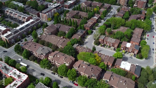 Aerial view by drone of Montreal's neighborhood, residential area, houses and streets