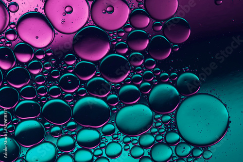 water drops on glass in colorful neon light