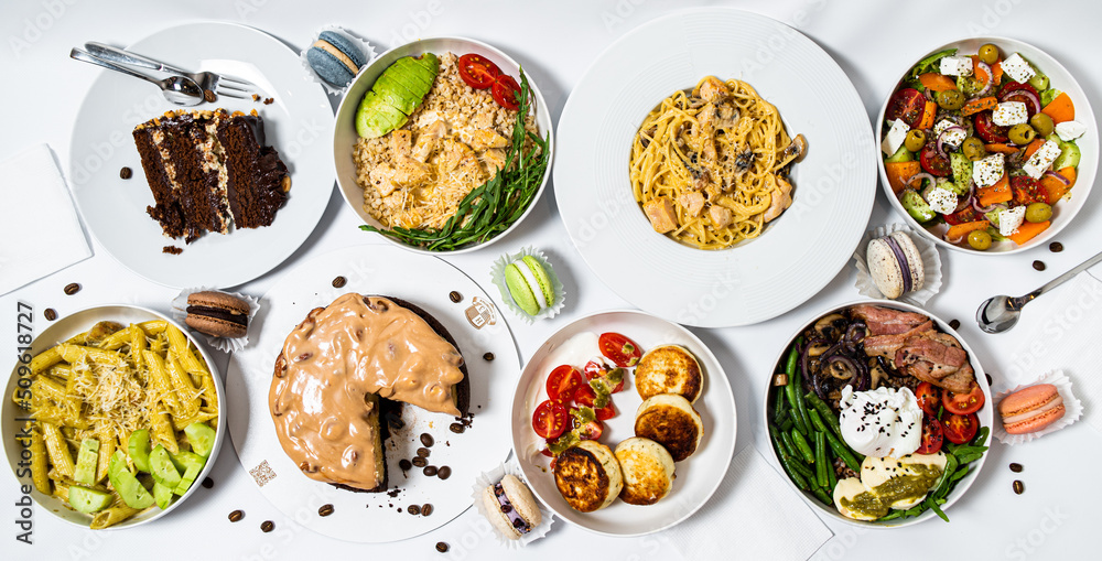 Set of festive meals of meat and vegetables and sweets on white background isolated. Menu set.