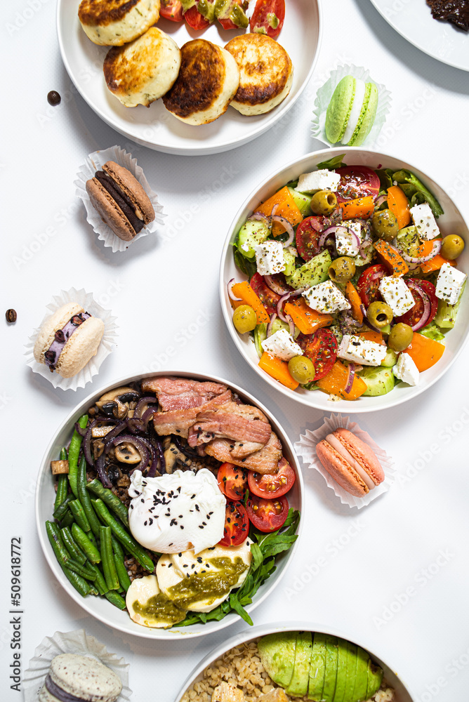 Set of festive meals of meat and vegetables and sweets on white background isolated. Menu set.