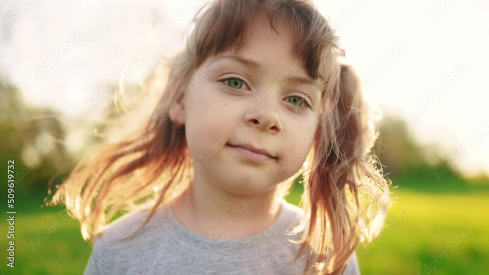 people in the park. portrait little sunlight girl outdoors. happy family kid dream concept. child a girl kid portrait close-up in the park glare. happy cute baby in summer outdoors close up portrait people in the park. portrait little sunlight girl outdoors. happy family kid dream concept. child a girl kid portrait close-up in the park glare. happy cute baby in summer outdoors close up portrait
