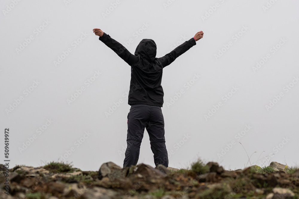 Selective focus shot of woman free in nature in foggy weather. Selective focus shot of woman free in nature in foggy weather.