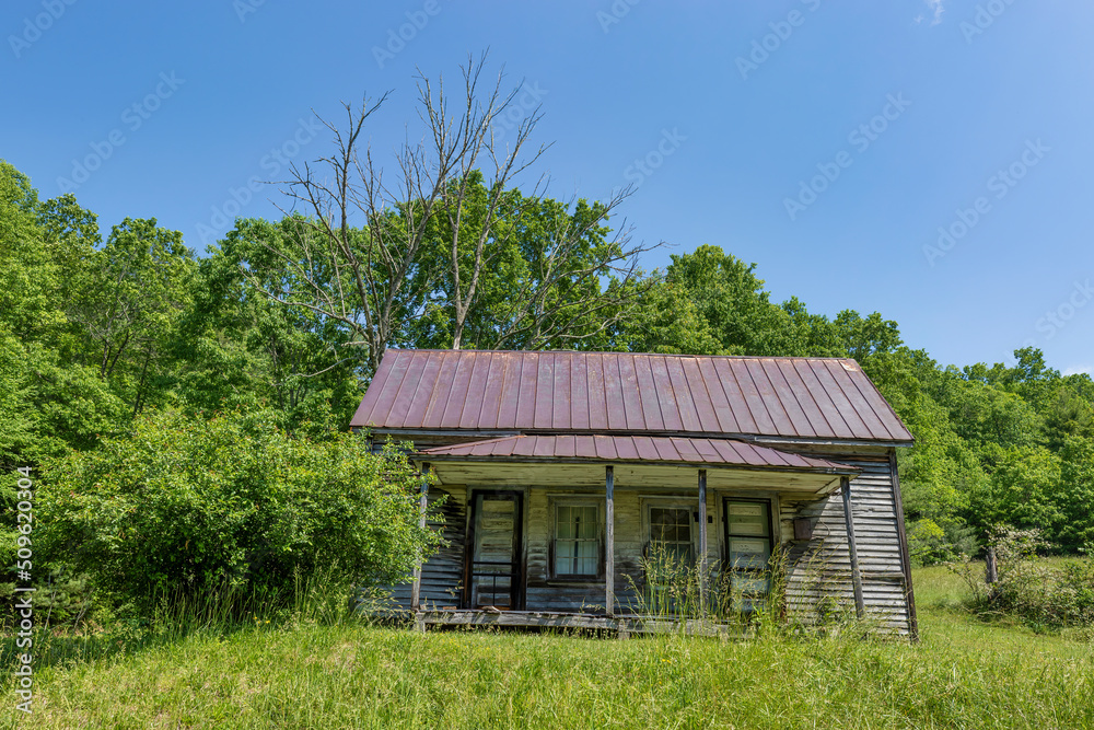 Decaying structure seen from the road in rural Tennessee, USA Decaying structure seen from the road in rural Tennessee, USA