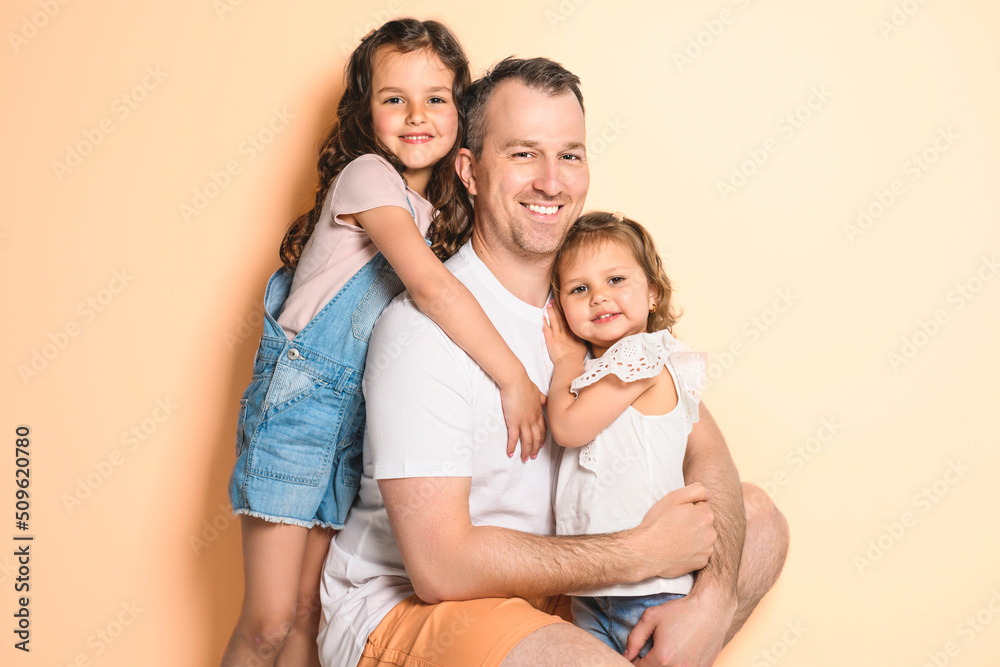 Father with his daughter on studio white background