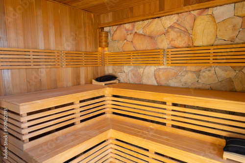 Modern interior of empty traditional wooden spa cabin with dry steam
