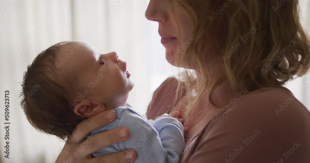 Video of happy caucasian mother kissing newborn baby Video of happy caucasian mother kissing newborn baby