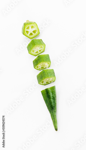 okra or Lady Finger pieces over on white banckground