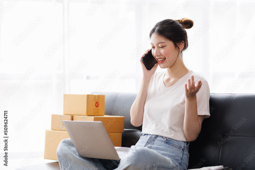 Business digital online SME small business a new startup in the present for an online shop. Happy Young Asian woman have a warehouse used to send a customer Entrepreneur owner SME or freelance concept Business digital online SME small business a new startup in the present for an online shop. Happy Young Asian woman have a warehouse used to send a customer Entrepreneur owner SME or freelance concept