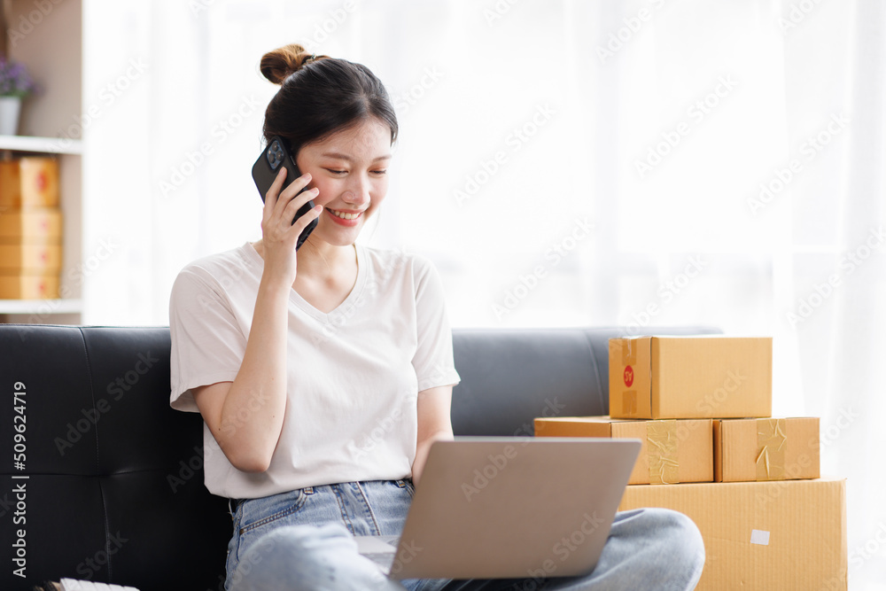 Business digital online SME small business a new startup in the present for an online shop. Happy Young Asian woman have a warehouse used to send a customer Entrepreneur owner SME or freelance concept Business digital online SME small business a new startup in the present for an online shop. Happy Young Asian woman have a warehouse used to send a customer Entrepreneur owner SME or freelance concept