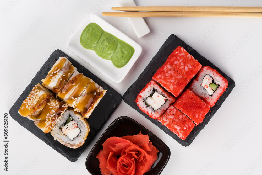 beautiful concept of japanese sushi and rolls on a light background