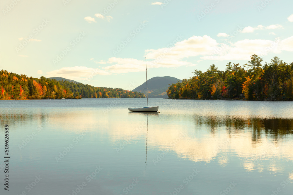 Small sailboat on the Long Pond in the Acadia National Park, Maine. Concept of tranquility and travel
