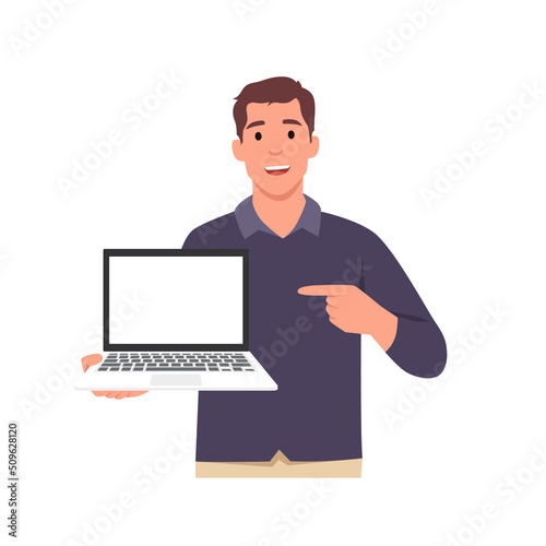 Young smiling man cartoon character holding or showing the blank screen of a laptop computer and pointing hand finger. . Flat vector illustration isolated on white background