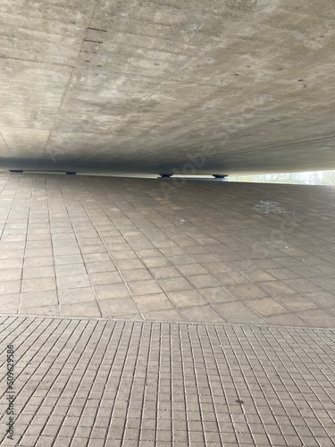under the concrete bridge