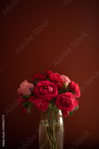 red rose bouquet on dark red background