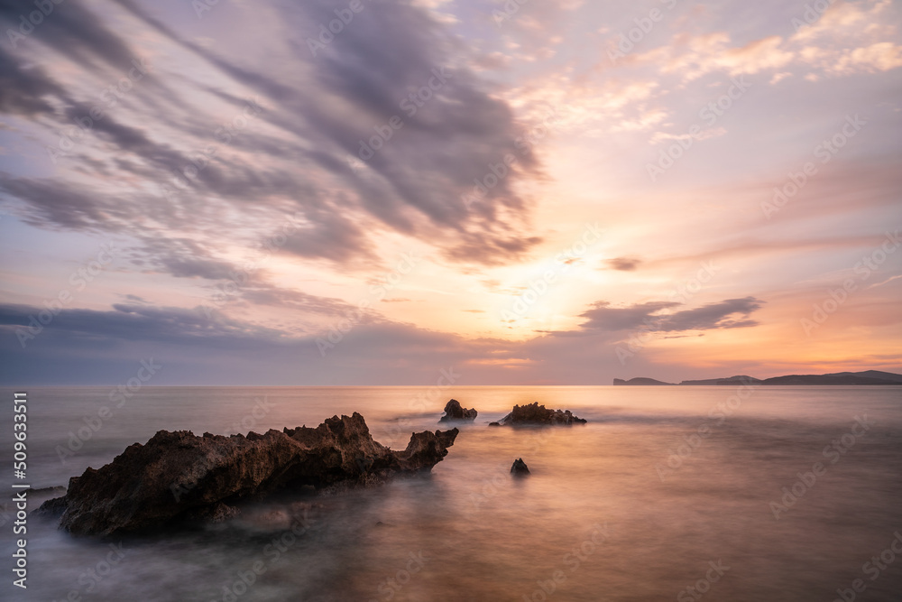 cloudy sunset at rocky beach