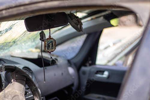 The driver's airbag deployed on the steering wheel of the car after the collision. Deflated airbags after flared deployment. The airbag deployed. Car after an accident. Safety device in the car. © Yevhen Roshchyn