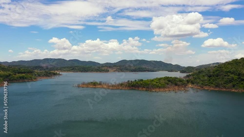 A beautiful lake surrounded by rainforest and mountains. Kalu Ganga Reservoir, Sri Lanka. photo