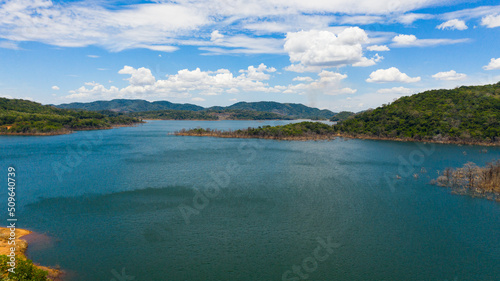 Tropical landscape: A mountain lake among beautiful mountains with forest. Kalu Ganga Reservoir, Sri Lanka.