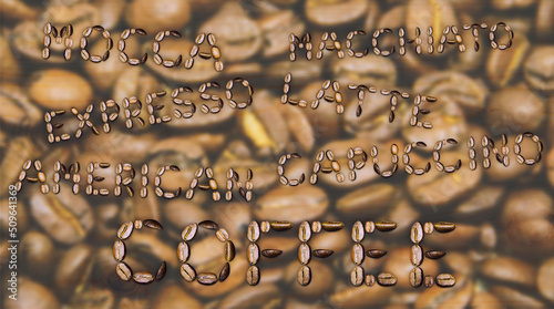 The word coffee made from coffee beans on the background of a cafe
