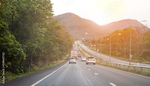 Country road, sunshine and mountains, forests