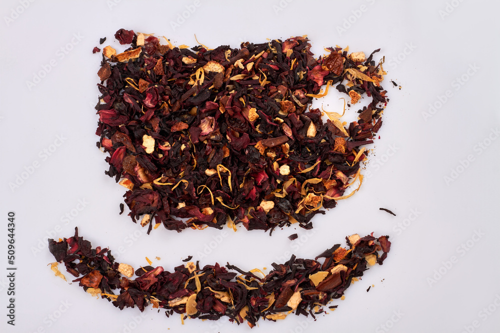 Many dry hibiscus petals in the shape of tea cup. Isolated on white background. Many dry hibiscus petals in the shape of tea cup. Isolated on white background.