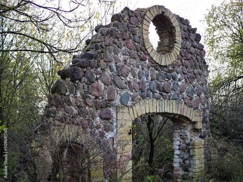 Beautiful stonework. The ruins of the old outbuildings of the estate of the Wrangel barons in the village of Torosovo. Volosovsky district, Leningrad region, Russia. photo