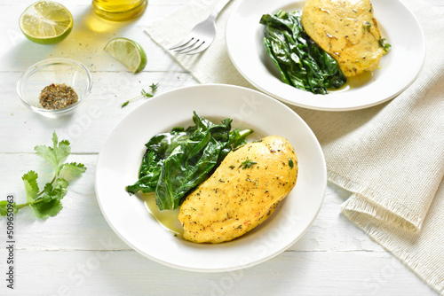 Baked turmeric chicken breast and sauteed spinach