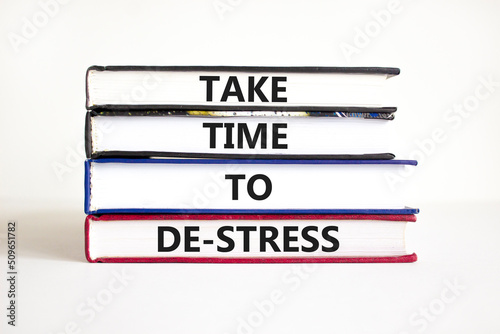 Take time to de-stress symbol. Concept words Take time to de-stress on books on a beautiful white table white background. Psychological business and take time to de-stress concept. Copy space. photo