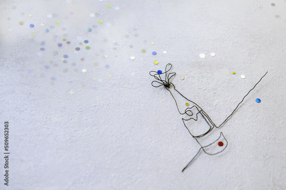 Fototapeta premium Continuous line drawing of champagne bottle with colored fireworks flakes. Flat lay of Celebration. Abstract champagne bottle.