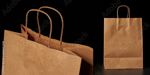 A mockup brown paper bag on a black background with logo space and twisted pens. Eco bag. The layout of the packaging template.