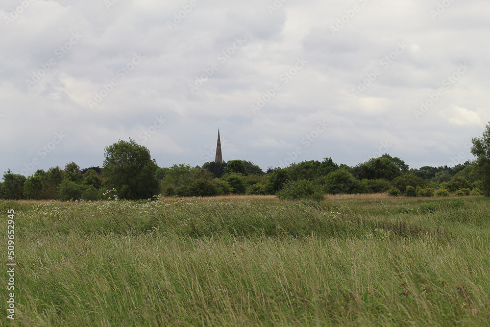 A beautiful landscape shot at Lunt Nature reserve in Merseyside. Home to the famous barn owl. This photo was taken in summer, although that is not noticeable in the grey and miserable sky, A beautiful landscape shot at Lunt Nature reserve in Merseyside. Home to the famous barn owl. This photo was taken in summer, although that is not noticeable in the grey and miserable sky,
