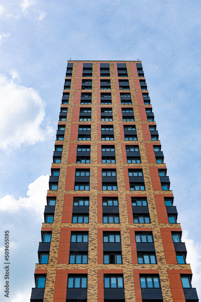 high apartment building against the blue sky high apartment building against the blue sky