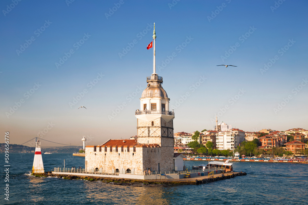 Maiden's Tower (Kiz Kulesi) illuminated at dawn. Istanbul, Turkey Maiden's Tower (Kiz Kulesi) illuminated at dawn. Istanbul, Turkey