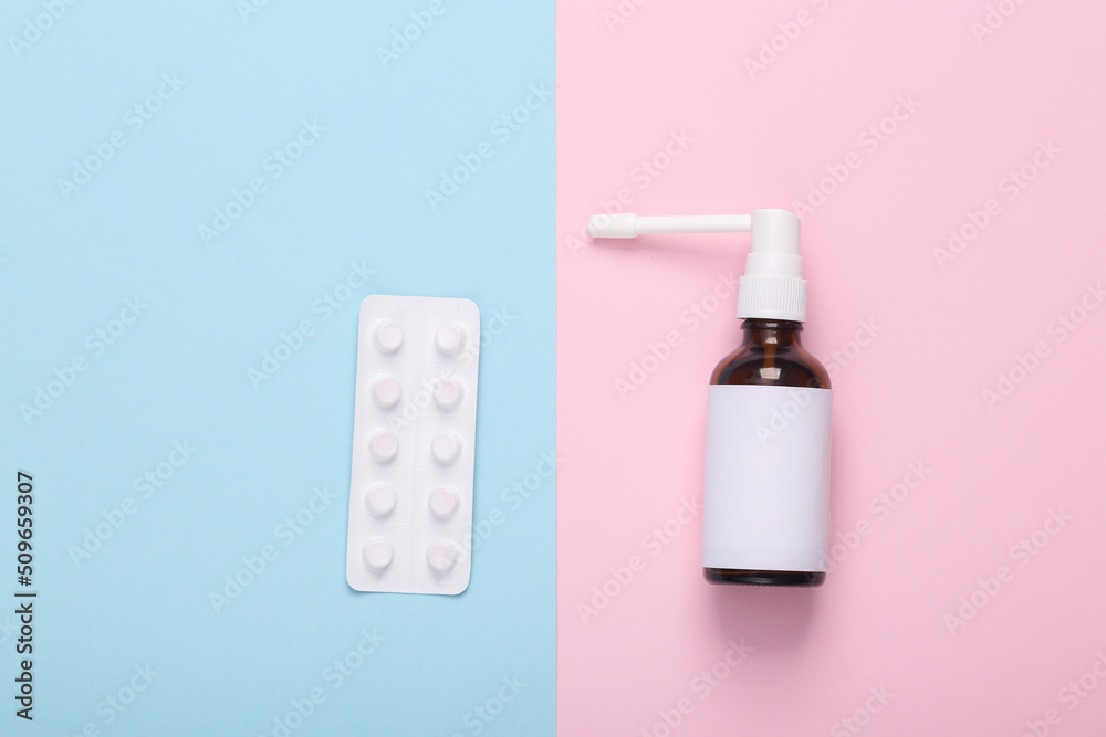 Mockup Throat spray with white empty labels and white blister of pills on blue pink background. Mockup Throat spray with white empty labels and white blister of pills on blue pink background.