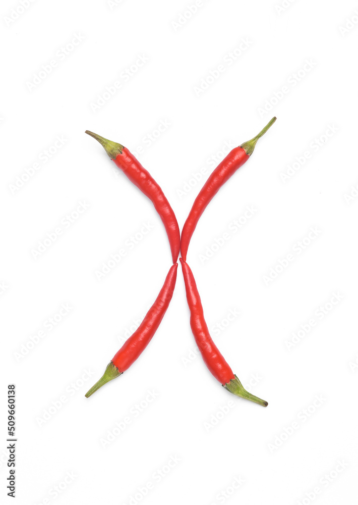 Letter X made from red chilli peppers isolated on white background Letter X made from red chilli peppers isolated on white background