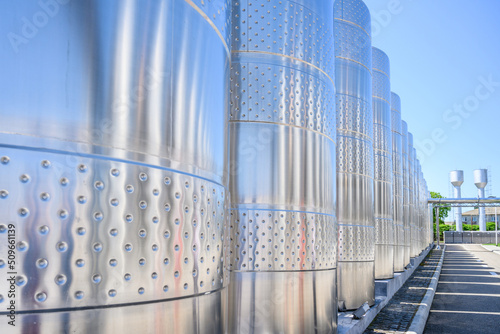 Wine steel tanks, equipment of contemporary winemaker factory. Barrels for wine storage. Equipment for the fermentation, distillation of alcohol. Preparation workshop for pure alcohols.