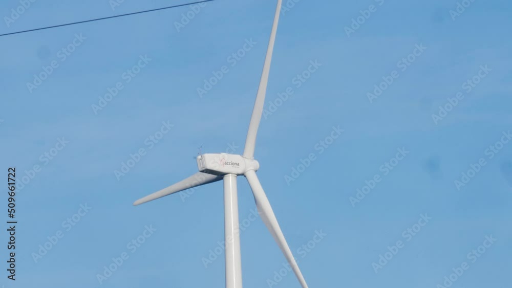Windmill farm, wind electro eco energy, turbines on blue sky background on european pyrenees mountains. Windmill farm, wind electro eco energy, turbines on blue sky background on european pyrenees mountains.