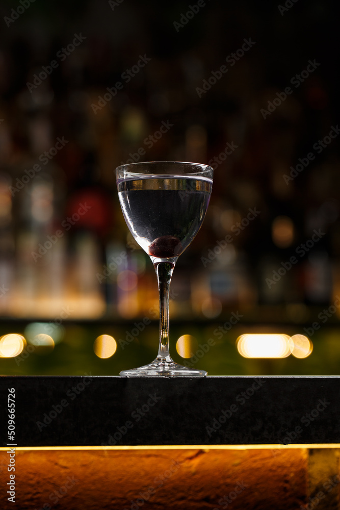 Aviation, drink with gin, lemon juice, maraschino liqueur and violet cream liqueur standing on bar counter.