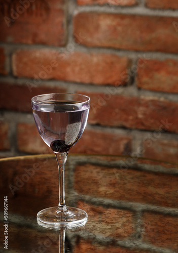 Obraz na płótnie Aviation, drink with gin, lemon juice, maraschino liqueur and violet cream liqueur standing on bar counter. w salonie